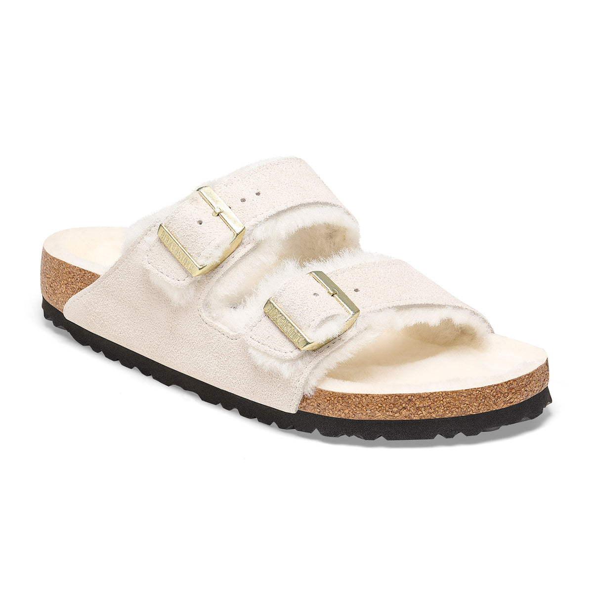 Front detail of the two-strap Birkenstock Arizona Shearling sandal in Antique White suede. Fully lined in genuine shearling over Birkenstock cork latex footbed.