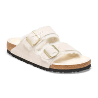 Front detail of the two-strap Birkenstock Arizona Shearling sandal in Antique White suede. Fully lined in genuine shearling over Birkenstock cork latex footbed.