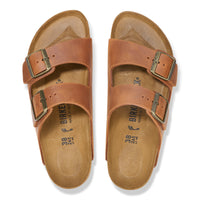 Overhead view of the classic Cognac brown oiled leather Arizona sandal by Birkenstock featuring original footbed and unique oiled finish.
