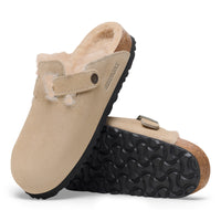 Side and bottom view of Birkenstock Boston Shearling Clogs in Taupe Suede showing black EVA outsole and natural suede upper