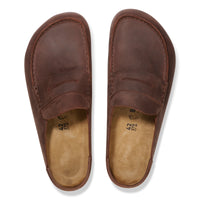 Pair of brown leather slip-on clogs on a white background
Birkenstock Naples Clog Wrapped in Habana Oiled Leather