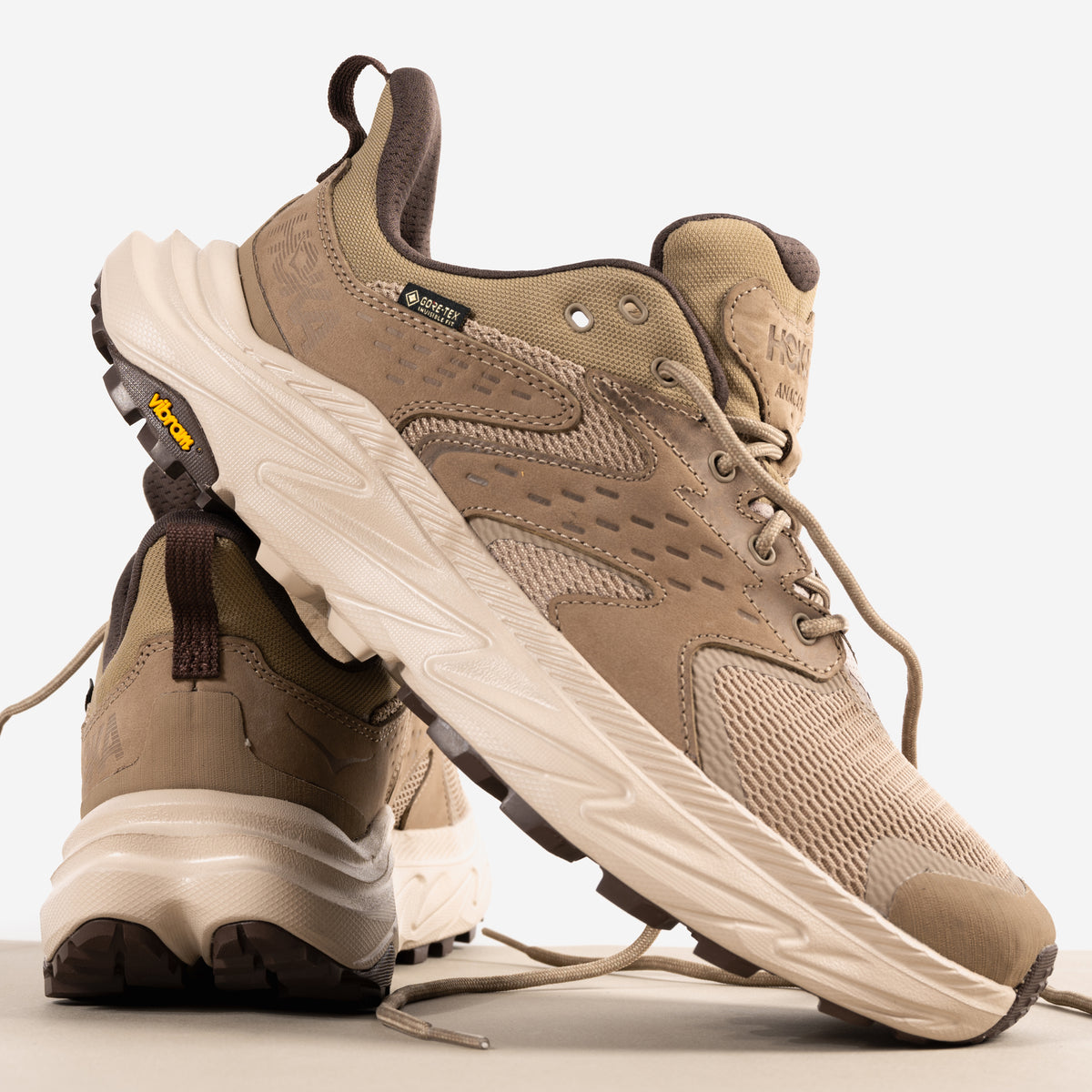 Exterior and heel view of the GORE-TEX waterproof upper on the Men's HOKA Anacapa 2 Low GTX Waterproof Hiking Shoe in Dune Nubuck Leather