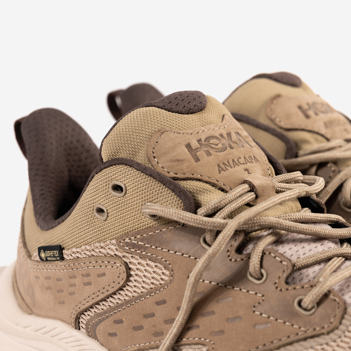 Padded tongue detail on the Men's HOKA Anacapa 2 Low GTX Waterproof Hiking Shoe in Dune Nubuck Leather