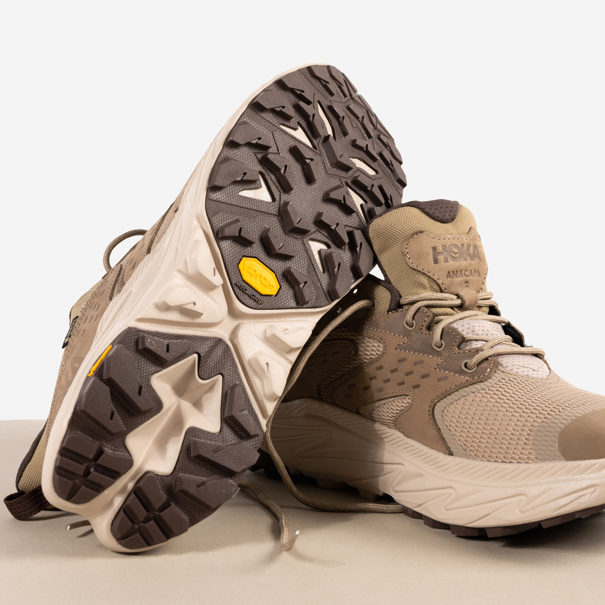 Vibram anti-slip Megagrip sole on the Men's HOKA Anacapa 2 Low GTX Waterproof Hiking Shoe in Dune Nubuck Leather