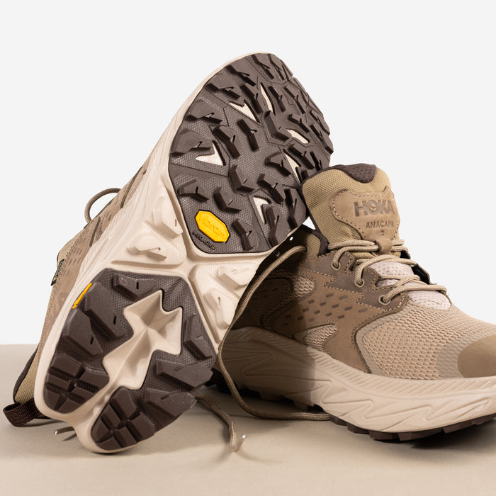 Vibram anti-slip Megagrip sole on the Men's HOKA Anacapa 2 Low GTX Waterproof Hiking Shoe in Dune Nubuck Leather