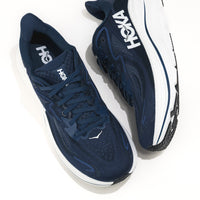 Navy running shoes with white soles and 'Hoka' branding on a white background.
Men's HOKA Clifton 10 Lightweight Running Shoe in Navy/White