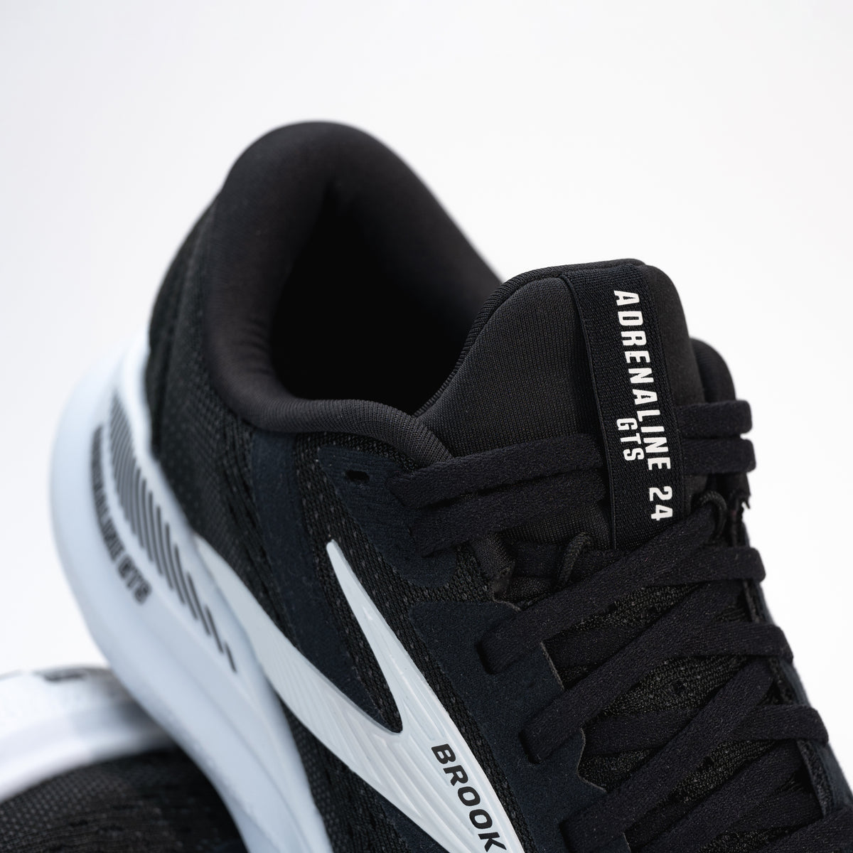 Close-up of laces on the Brooks Adrenaline GTS 24, emphasizing the snug, secure fit of the running shoe.
