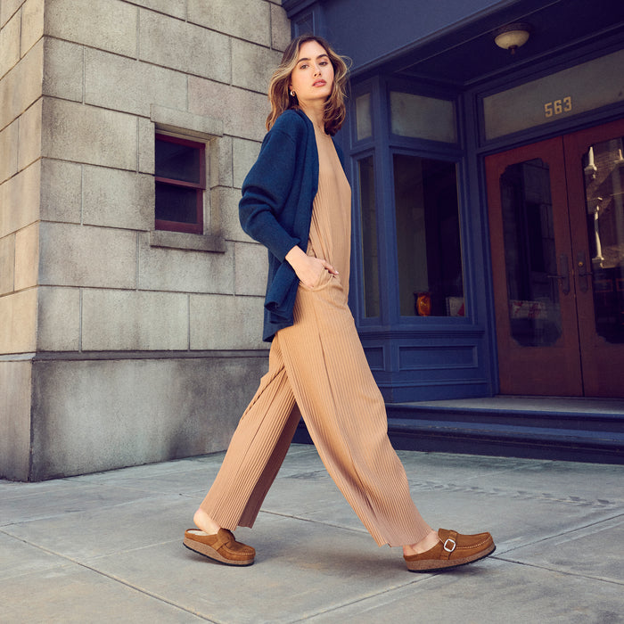 Women's Birkenstock Buckley Fashion Shearling Clog in Tea Suede Leather - Woman wearing outdoors