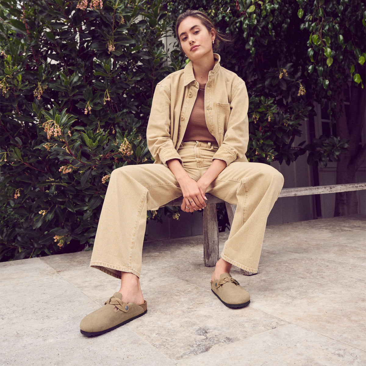 Lifestyle photo of a woman's monochromatic fall outfit styled with the Birkenstock Boston Braid in Taupe Suede.
