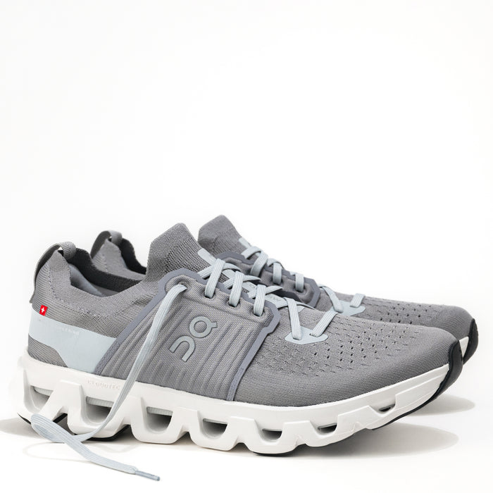 Gray athletic shoe with white sole on a white background.
Men's On Running Cloudswift 4 Road Running Shoe in Alloy/Glacier