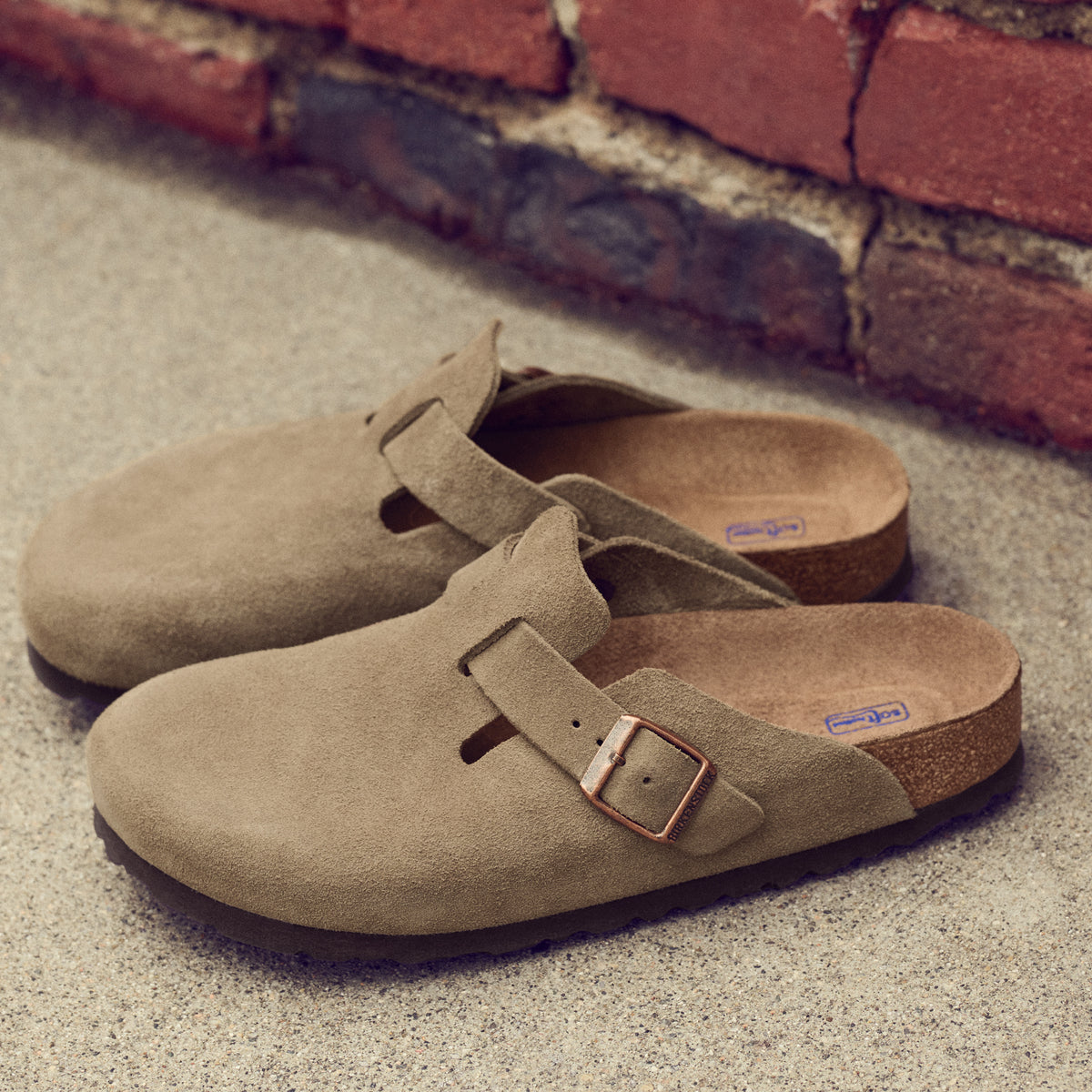 Birkenstock Boston Soft clog in Taupe Suede, featuring premium suede leather for all-day comfort. Classic slip-on style with soft footbed support, ideal for casual wear, gardening, or daily errands. Durable, lightweight, and built for long-lasting use, perfect for men and women seeking comfort and trendiness in footwear.