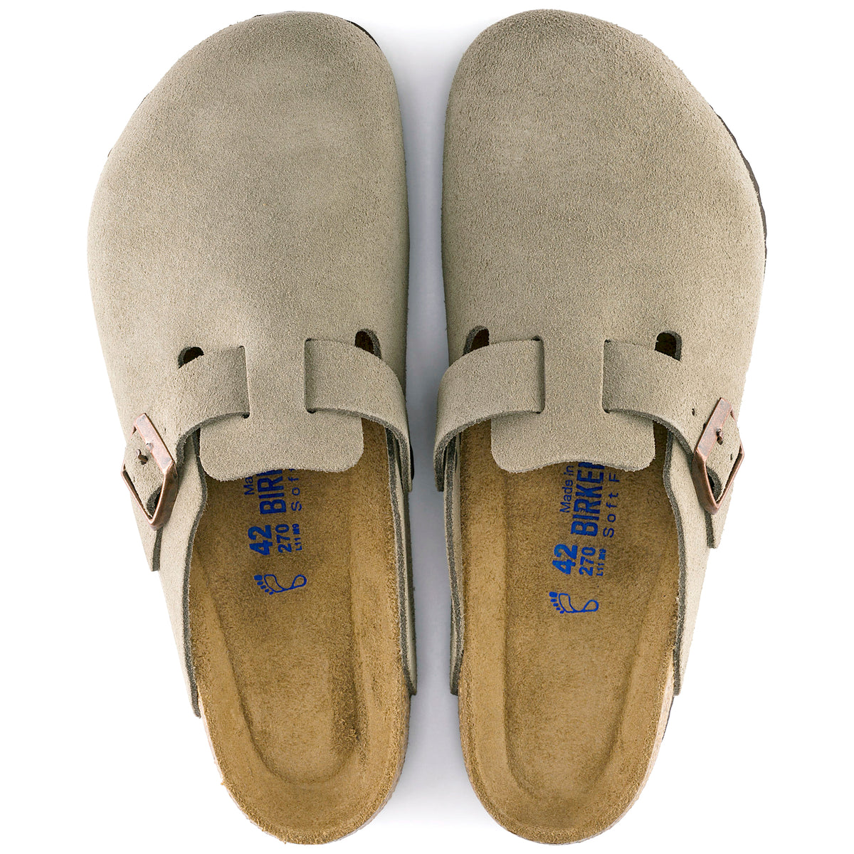 Pair of taupe Birkenstock clogs on a white background.
Birkenstock Boston Soft clog in Taupe Suede, featuring premium suede leather for all-day comfort. Classic slip-on style with soft footbed support. Durable, lightweight, and built for long-lasting use, perfect for men and women seeking comfort and trendiness in footwear.