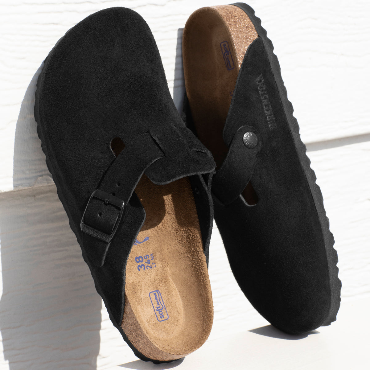 Birkenstock Boston Soft clog in Black Suede, featuring premium suede leather for all-day comfort. Classic slip-on style with soft footbed support, ideal for casual wear, gardening, or daily errands. Durable, lightweight, and built for long-lasting use, perfect for men and women seeking comfort and trendiness in footwear.