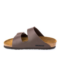 Side view of the Unisex BIRKENSTOCK Arizona in Brown BIRKO-FLOR, a classic laid-back sandal in an adjustable two-strap style and a contoured cork-latex footbed.