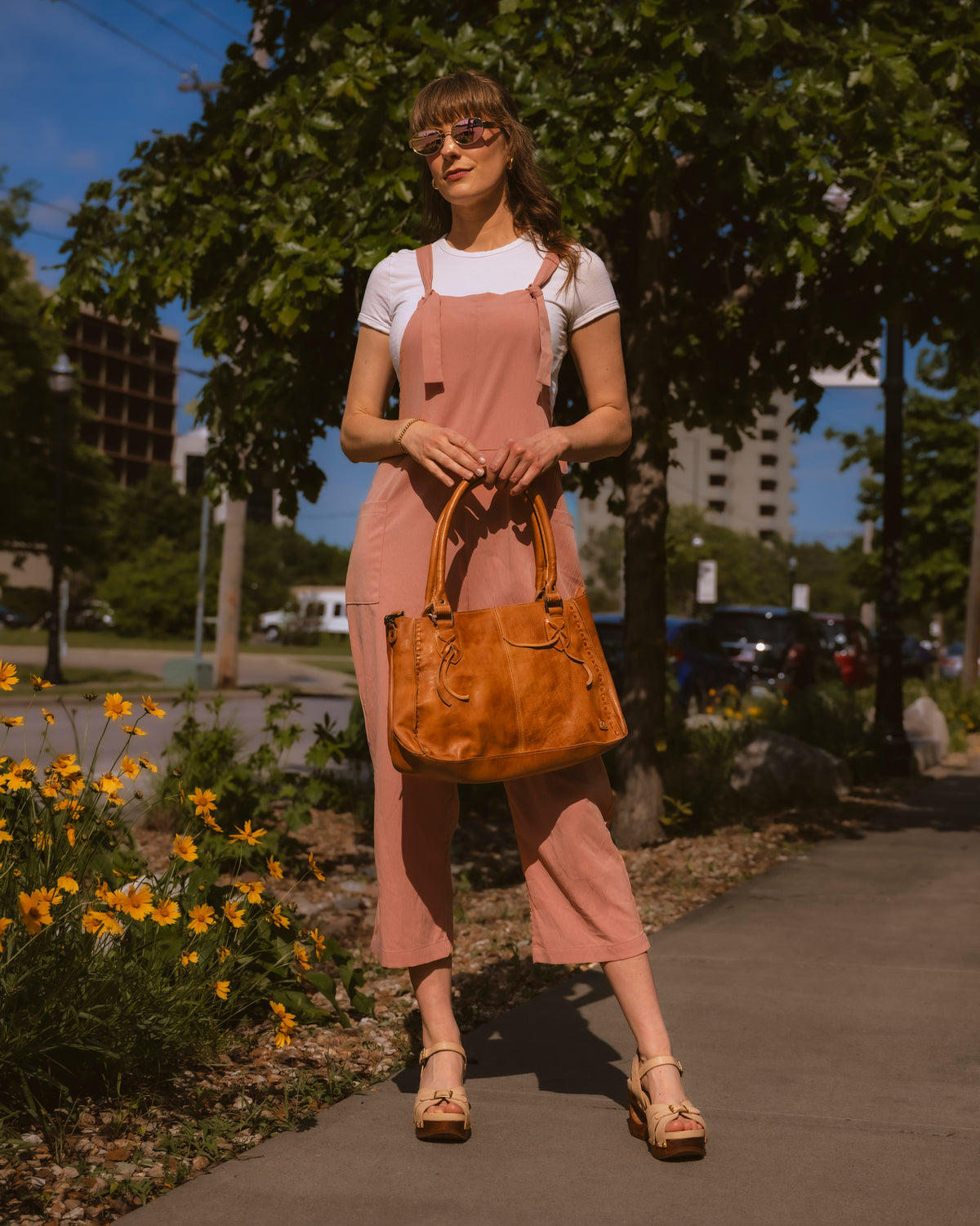 Dansko Alanna Wood Wedge sandal in Vanilla leather with Bed|Stu Rockababy leather handbag in Rustic Tan