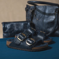 Matching NAVY/MIDNIGHT accessories with the Women's Birkenstock Arizona Big Buckle Sandal in Midnight Oiled Leather with Soft Genuine Shearling Lining