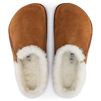 Overhead detail of Birkenstock Zermatt in Mink suede, focusing on decorative stitching, cozy genuine shearling lining and logo rivet