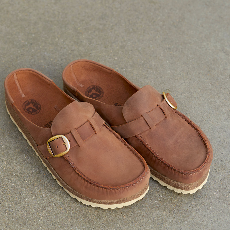 Overhead detail view of the Women's Birkenstock Buckley in Cognac oiled leather, a moccasin-style design with a unique integrated molded cork latex footbed for ultimate comfort and all day support. 