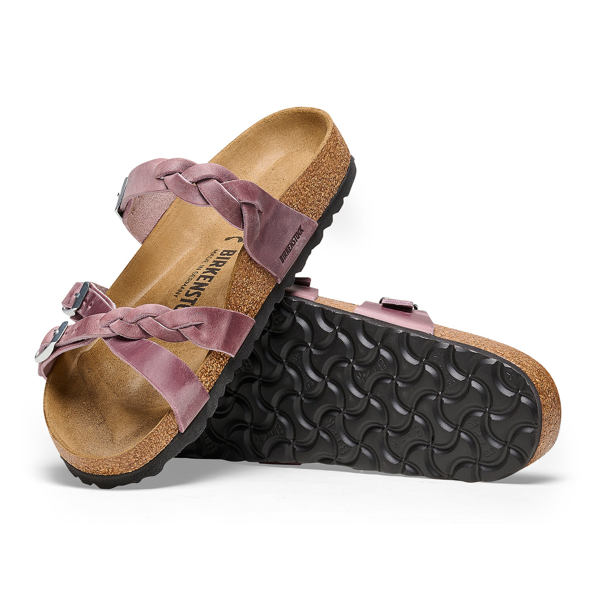 Side and outsole detail of the soft braided oiled leather straps and textured sole of the Birkenstock Franca slip-on sandal.