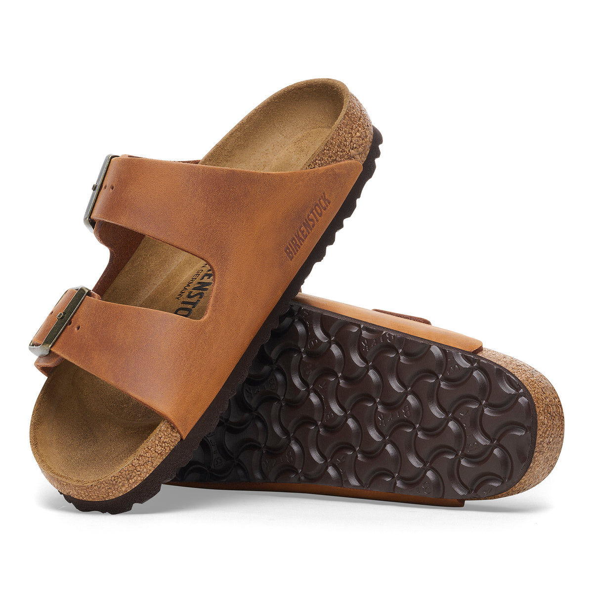 Profile view of the classic Cognac brown oiled leather Arizona sandal by Birkenstock featuring original footbed and unique oiled finish. 