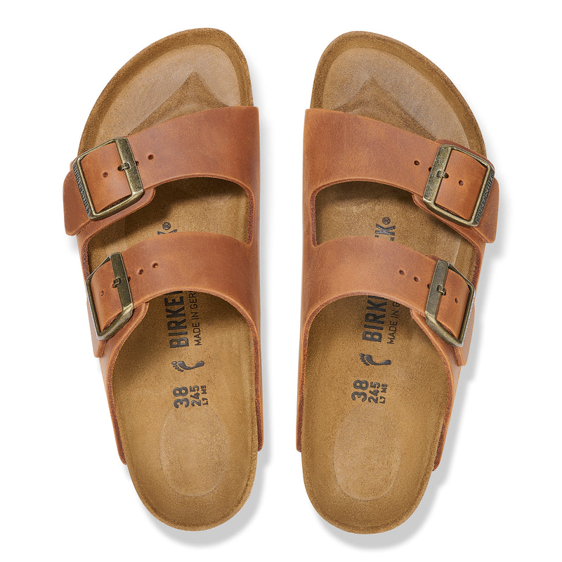 Overhead view of the classic Cognac brown oiled leather Arizona sandal by Birkenstock featuring original footbed and unique oiled finish. 