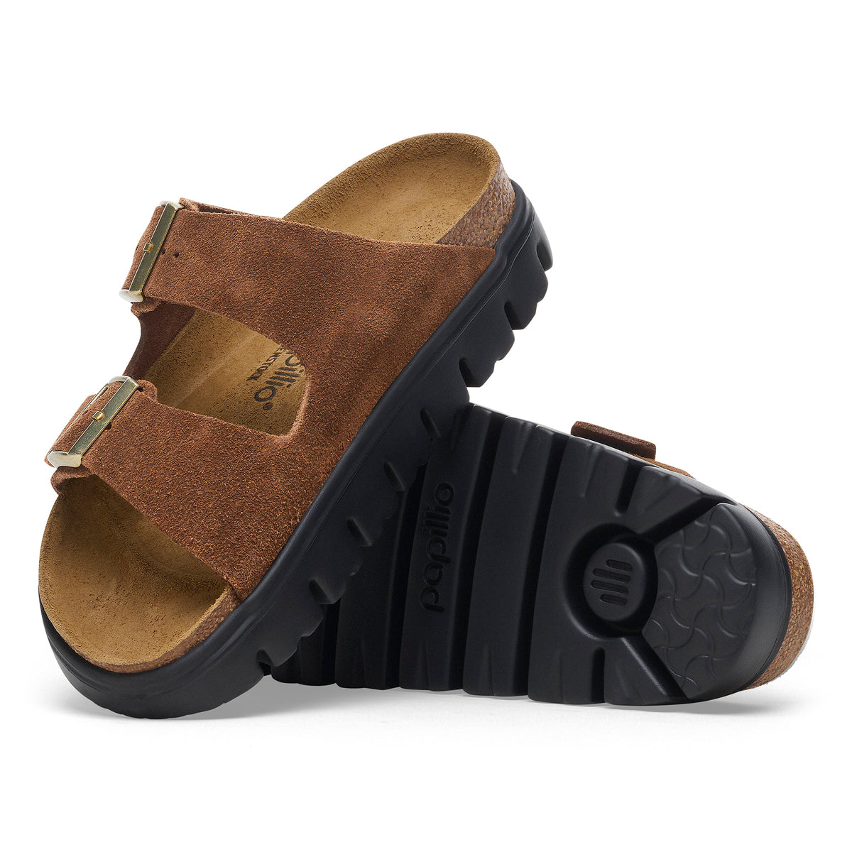 Side and bottom detail view of the Birkenstock Arizona Chunky sandal in Dark Tea / Brown suede leather. A chunky platform sole takes the Arizona sandal's classic design to new heights—and your style along with it. The statement tread stands out below a classic suede upper. Built on a supportive contoured footbed, this platform is always ready to get up to something.