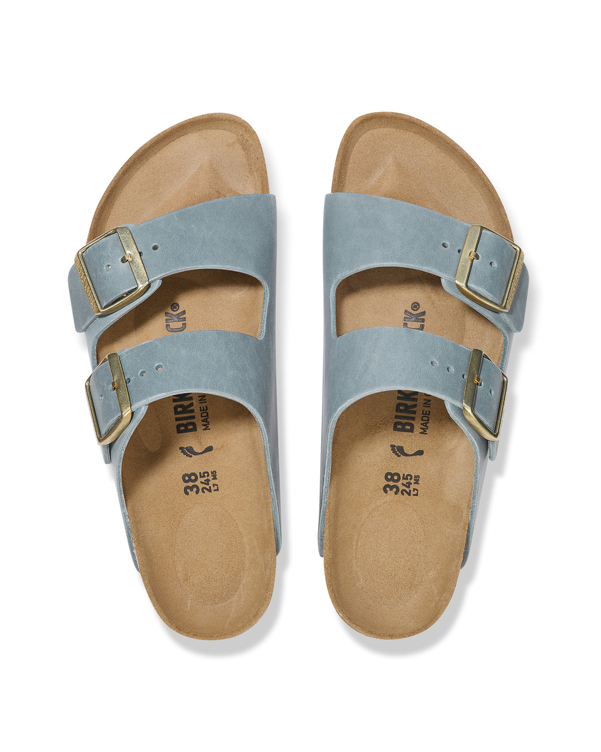 Overhead view of a pair of light blue "Basalt" colored Birkenstock Arizona two-strap sandals with gold buckles on a white background