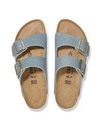 Overhead view of a pair of light blue "Basalt" colored Birkenstock Arizona two-strap sandals with gold buckles on a white background