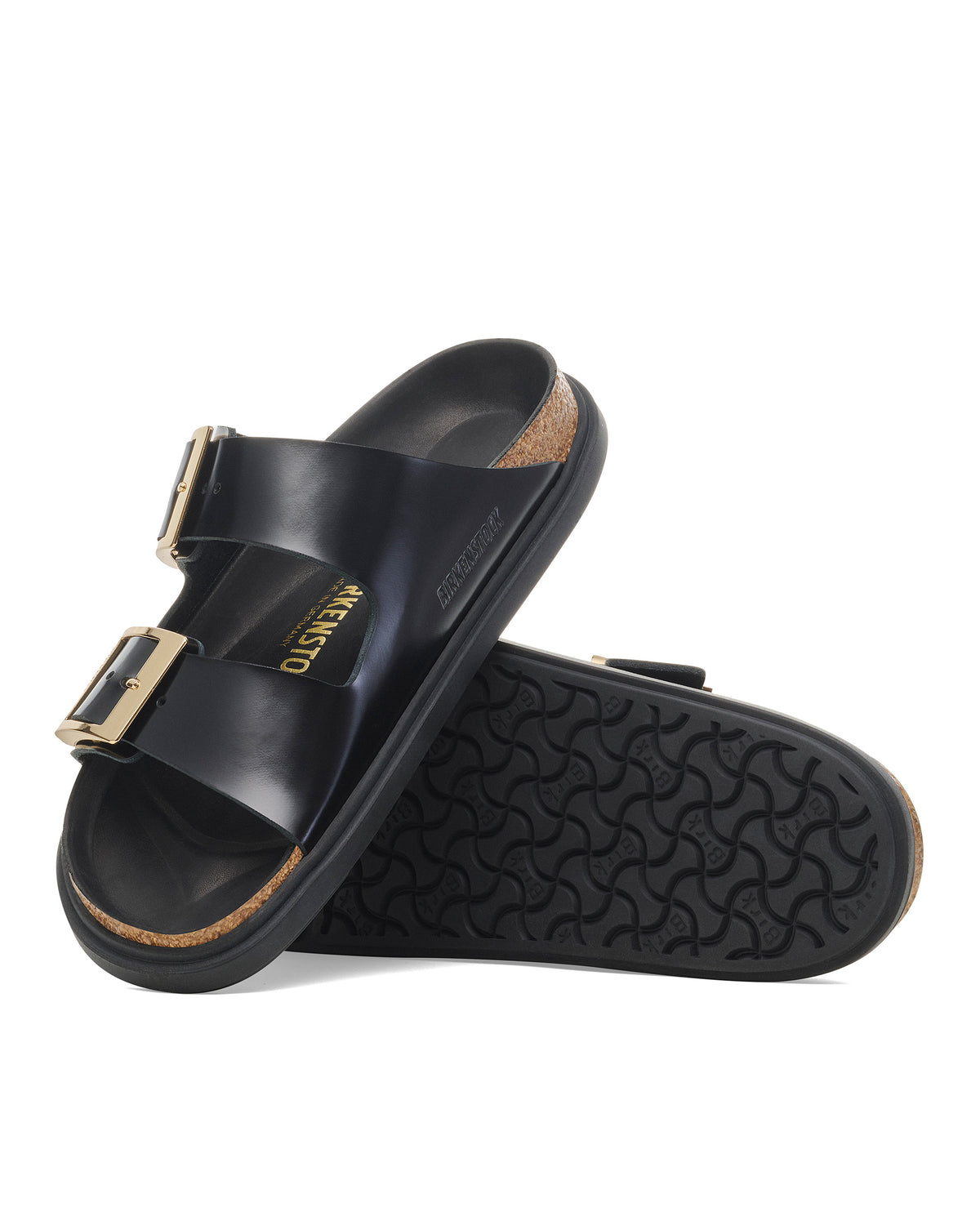 Black limited-edition Arizona Droplet Buckle sandals with gold buckles and slip-resistant rubber outsole on a white background