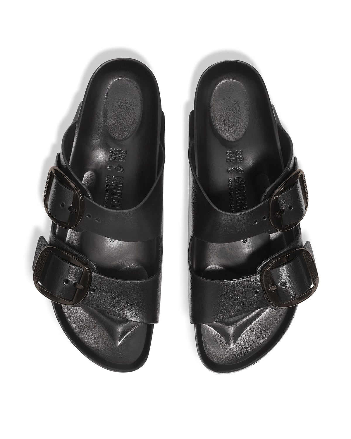 Overhead product photo of a pair of Birkenstock EVA Big Buckle Arizona Stealth sandals isolated on white