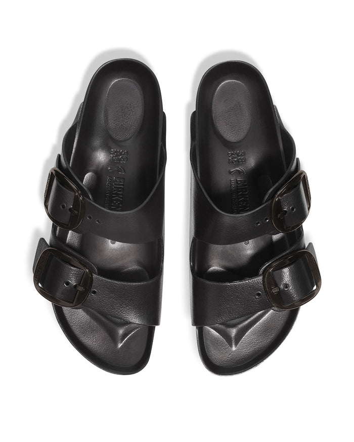 Overhead product photo of a pair of Birkenstock EVA Big Buckle Arizona Stealth sandals isolated on white