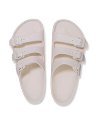 Pair of Birkenstock EVA Florida Flex Platform Sandals in Eggshell with three straps on a white background