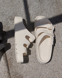 Birkenstock EVA Florida Flex Platform Sandal in Eggshell on a textured surface