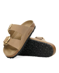 Angled shot of the Birkenstock Arizona Big Buckle Sandal in Tobacco Brown Oiled Leather showing outsole and Birkenstock logo on leather upper