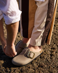 Birkenstock Boston Big Buckle Clog in Brown Oiled Leather – Heritage Comfort

The Boston Big Buckle brings a bold, premium hardware statement to a Birkenstock most-coveted classic slip-on clog. The seamless upper is built with substantial heritage oiled leather, measuring a rugged 2.8 to 3.2 millimeters in thickness. This premium hide features an untreated, oily-waxed surface finish that yields rich, organic color variations with every individual pair. It is designed to develop a personalized, vinta