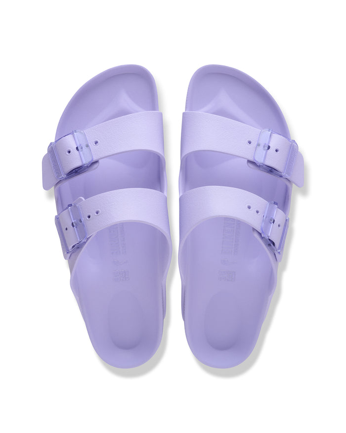 Pair of Birkenstock Arizona EVA Stealth Buckle sandals in Purple Fog on a white background