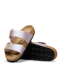 Birkenstock sandal with metallic purple strap and cork-latex footbed on a white background