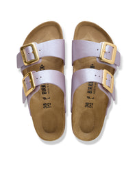 Birkenstock Sydney Luxe Buckle sandals with gold buckles and (Orchid) purple straps on a white background