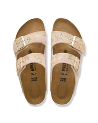 Pair of Birkenstock Arizona Sandcastle tan sandals with floral design on a white background