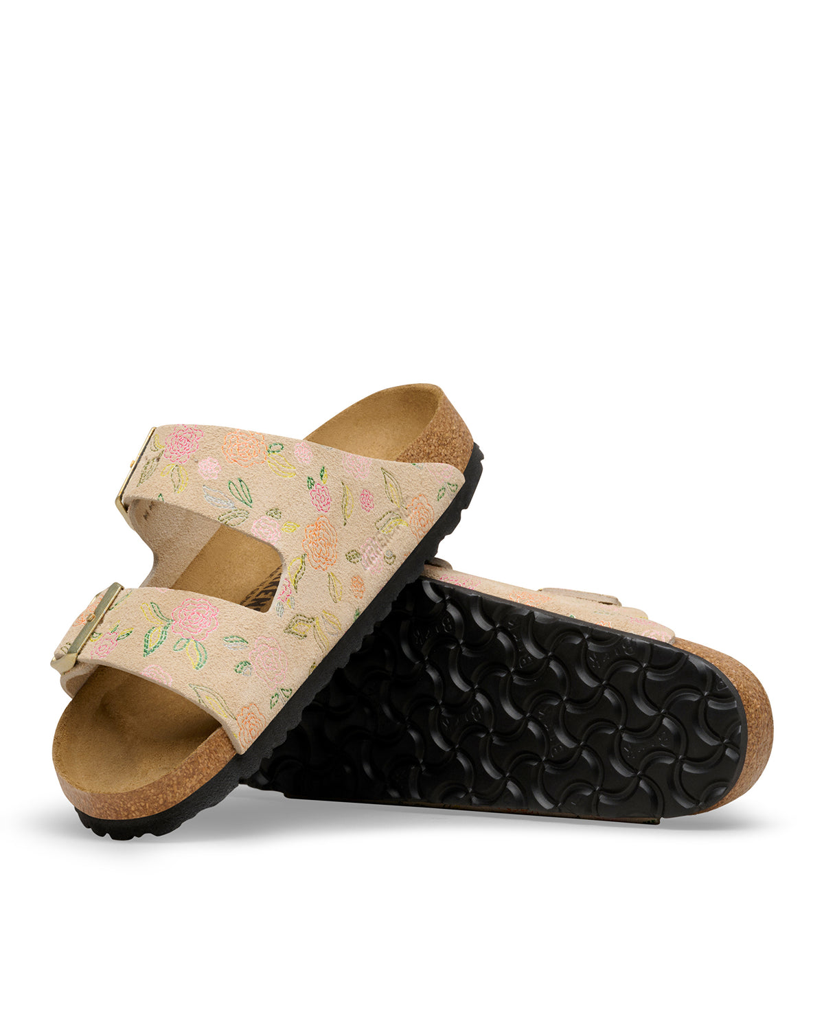 Pair of Birkenstock Arizona Sandcastle tan sandals with floral design on a white background