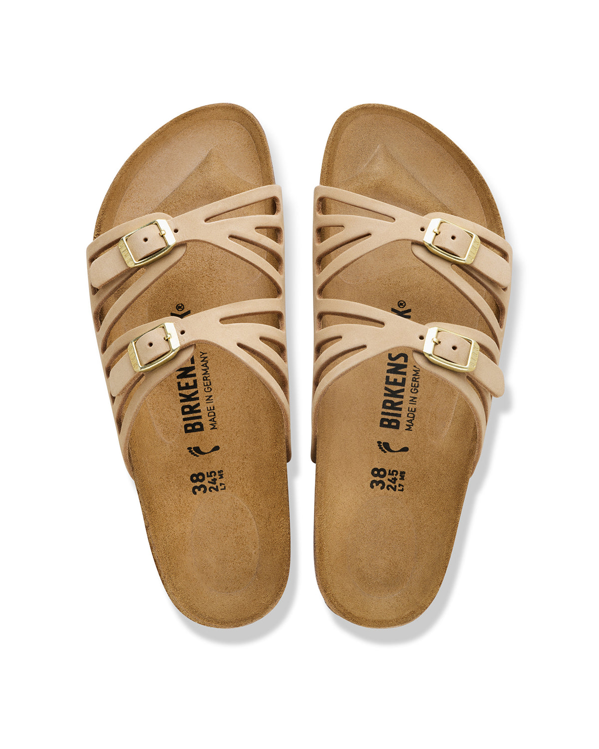 The Birkenstock Granada offers a refined, natural aesthetic for those who appreciate the support of a classic slide but want a more detailed look. This version is upgraded with premium nubuck leather, which is gently buffed to create a soft, velvety texture that feels luxurious from the first wear. The twin-strap design features elegant laser-cut perforations, providing a light and airy feel that transitions perfectly from a casual day out to a more put-together summer evening.