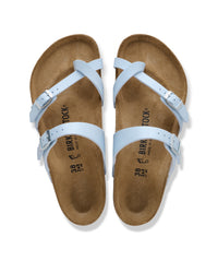 Birkenstock Mayari Birko-Flor Toe-Loop Sandals in Baby Blue

The Birkenstock Mayari is a favorite for those who want a more streamlined, secure feel without the heavy look of a traditional slide. This version features a unique crisscross design and a dedicated toe loop that keeps the sandal perfectly in place while you walk. This feminine crisscross style transitions easily from a morning at the farmer's market to a casual outdoor dinner.