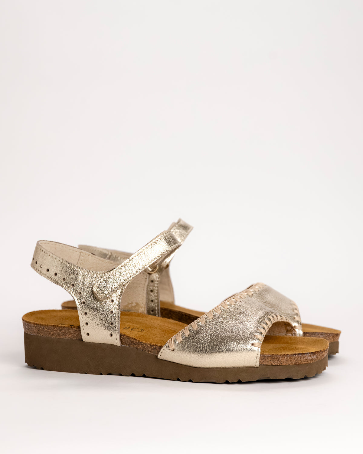Women’s Naot Luna leather sandal in Gold, side view on white background
