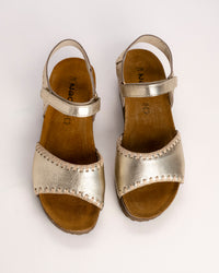 Top view of Naot Luna sandal showing contrast stitching detail on the Gold leather upper