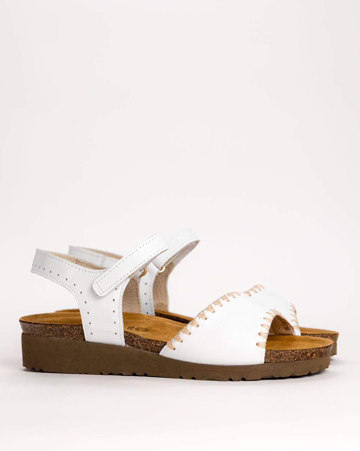 Women’s Naot Luna leather sandal in white, side view on white background