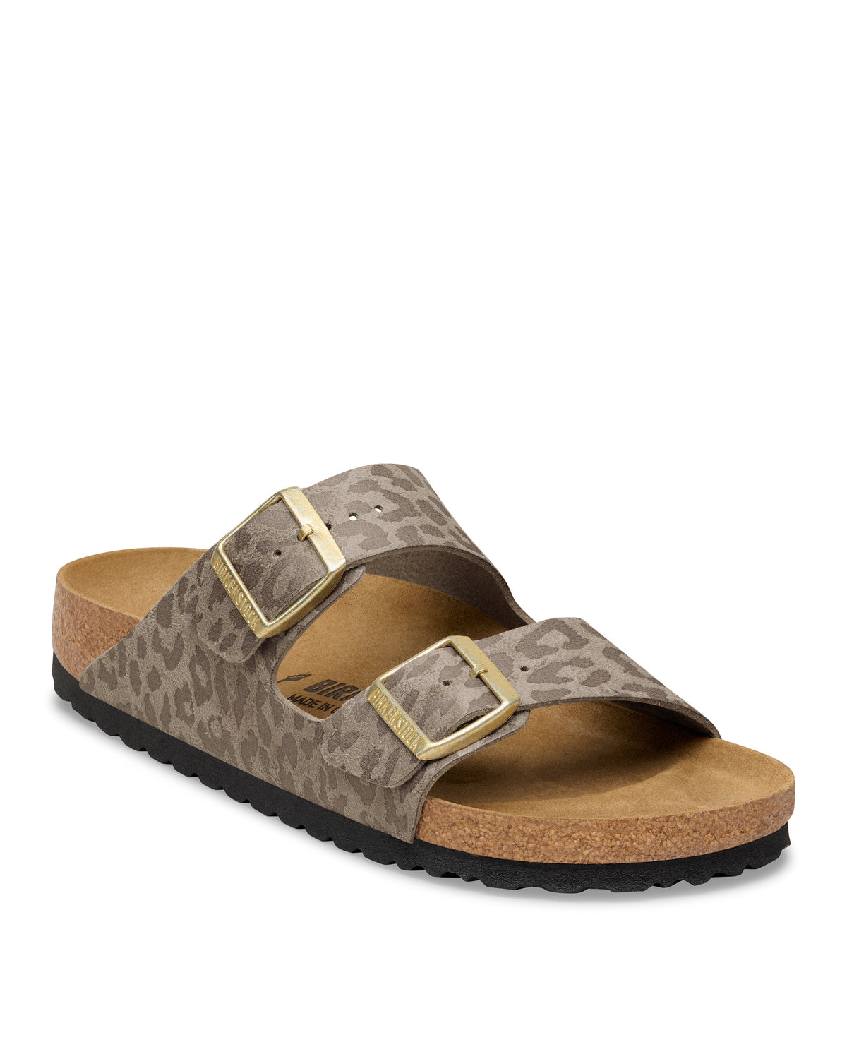 The Birkenstock Arizona Leopard Print Sandal in Birko-Flor brings a fierce, fashion-forward twist to the iconic style. This edition wraps the legendary two-strap silhouette in a bold, untamed animal print that serves as a neutral for any wardrobe. The upper is crafted from synthetic textured Birko-Flor, a skin-friendly and tear-resistant synthetic material that offers a sleek, leather-like finish. 