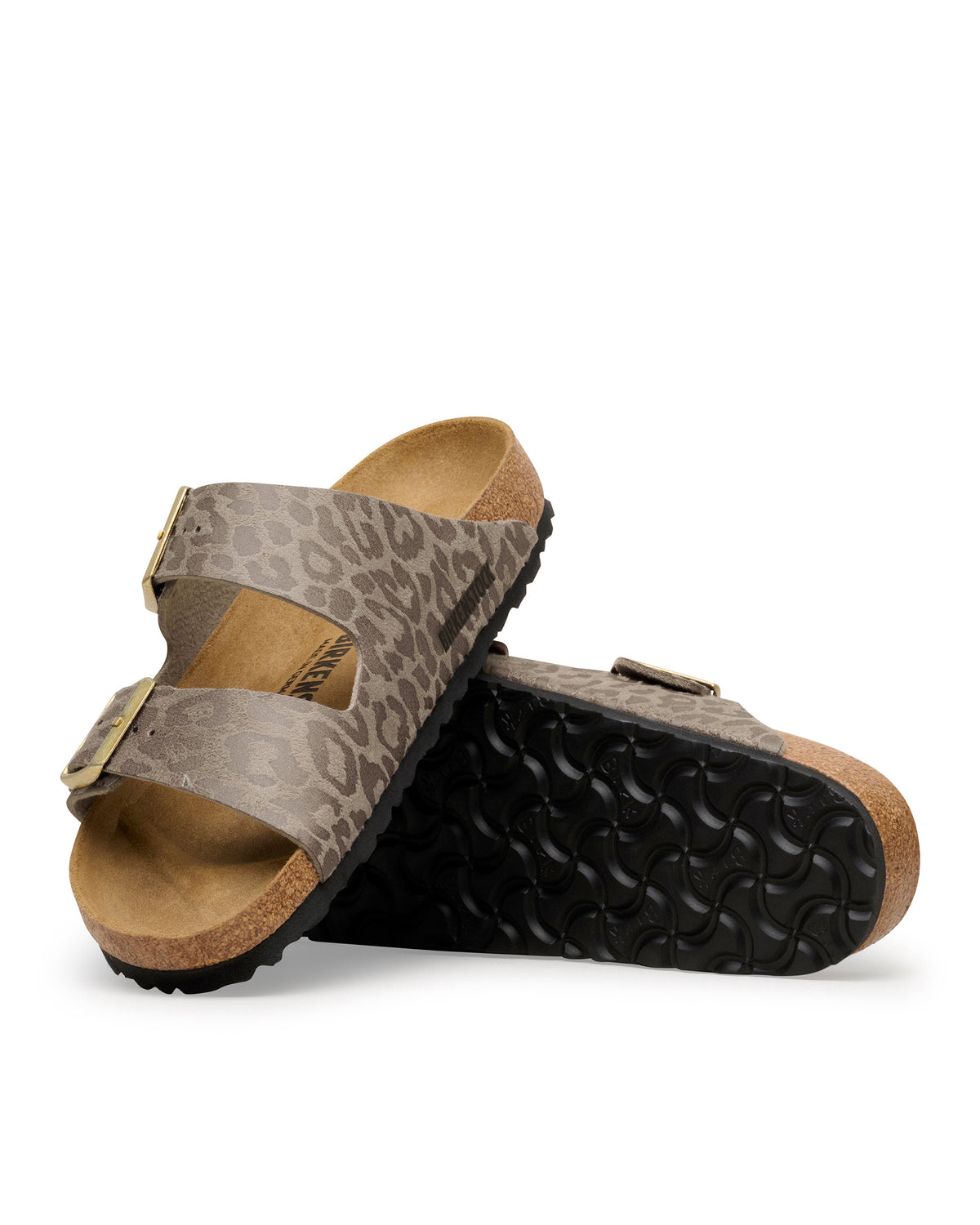 The Birkenstock Arizona Leopard Print Sandal in Birko-Flor brings a fierce, fashion-forward twist to the iconic style. This edition wraps the legendary two-strap silhouette in a bold, untamed animal print that serves as a neutral for any wardrobe. The upper is crafted from synthetic textured Birko-Flor, a skin-friendly and tear-resistant synthetic material that offers a sleek, leather-like finish. 