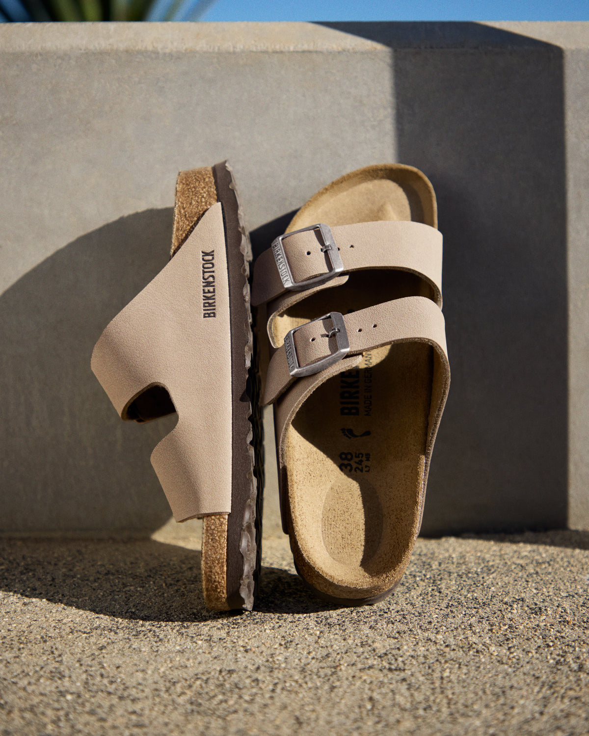 The Birkenstock Arizona is essentially the gold standard for slides, and this Birkibuc version is the practical answer for anyone who wants a rugged, low-maintenance look. Instead of traditional leather, these are crafted from a signature Birkenstock material called Birkibuc—a heavy-duty synthetic with a brushed finish that mimics the texture of real nubuck. It’s tough, easy to wipe down, and holds its shape through seasons of wear.