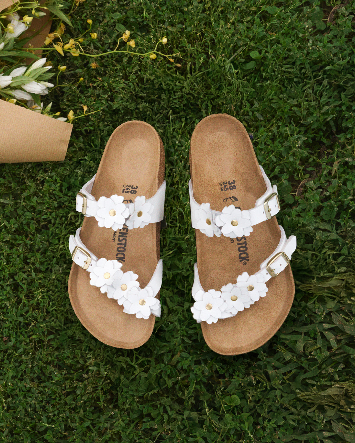 Garden party must-have. The Mayari Flowers takes that classic, secure toe-loop design we all love and dresses it up with sweet leather floral appliqués.&nbsp;A slightly more "feminine" take on the utility look, making it easy to pair with sundresses or cropped denim without feeling too sporty.