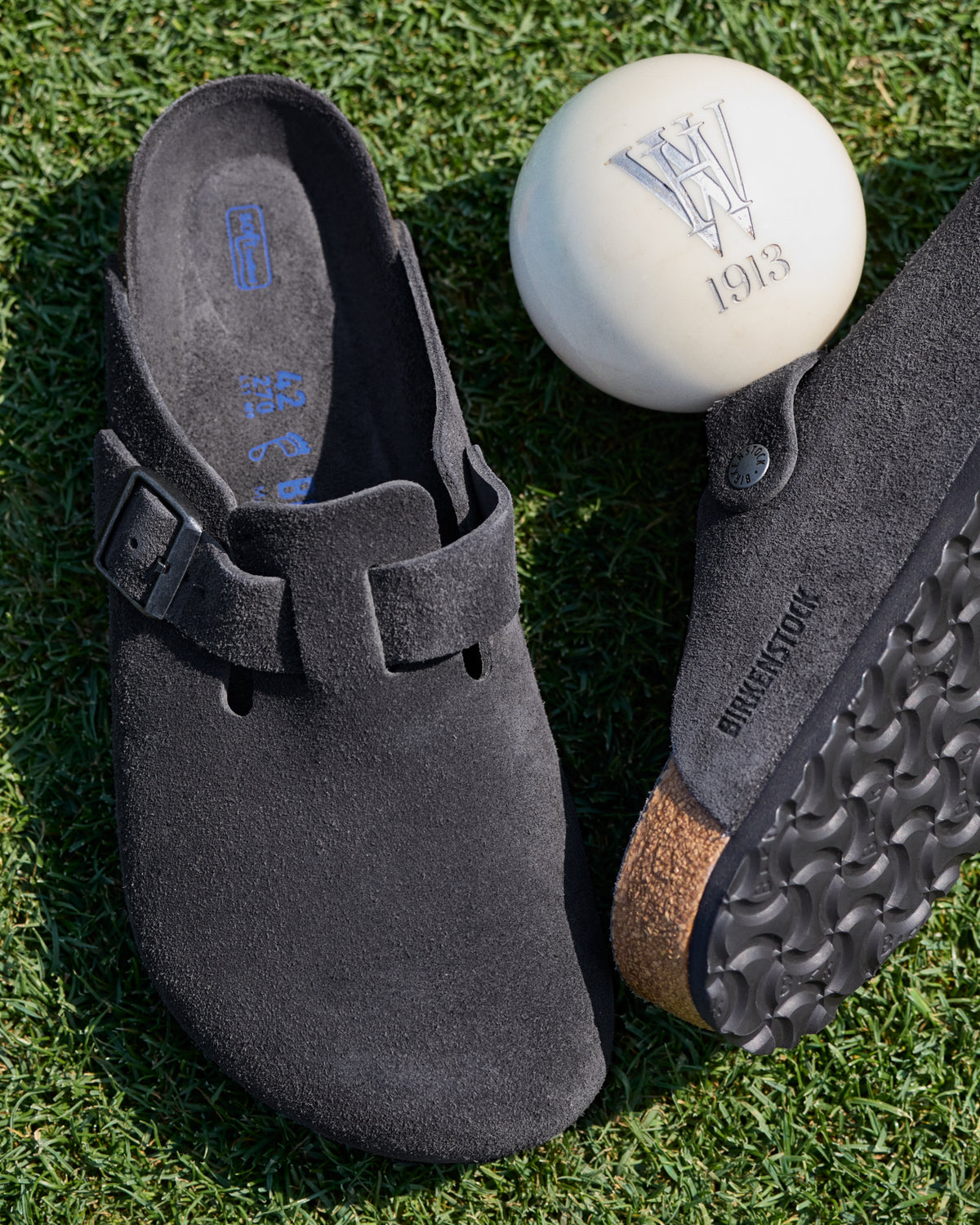 Birkenstock Boston Soft Footbed Suede Leather Clog in Charcoal

The Birkenstock Boston Clog has transitioned from a lounge staple to a street-style icon, and this version offers the most "broken-in" feel right out of the box. Crafted from premium, velvety suede, the upper has a soft, flexible drape that conforms comfortably to the foot. The standout feature is the integrated latex foam layer tucked inside the signature cork footbed. 